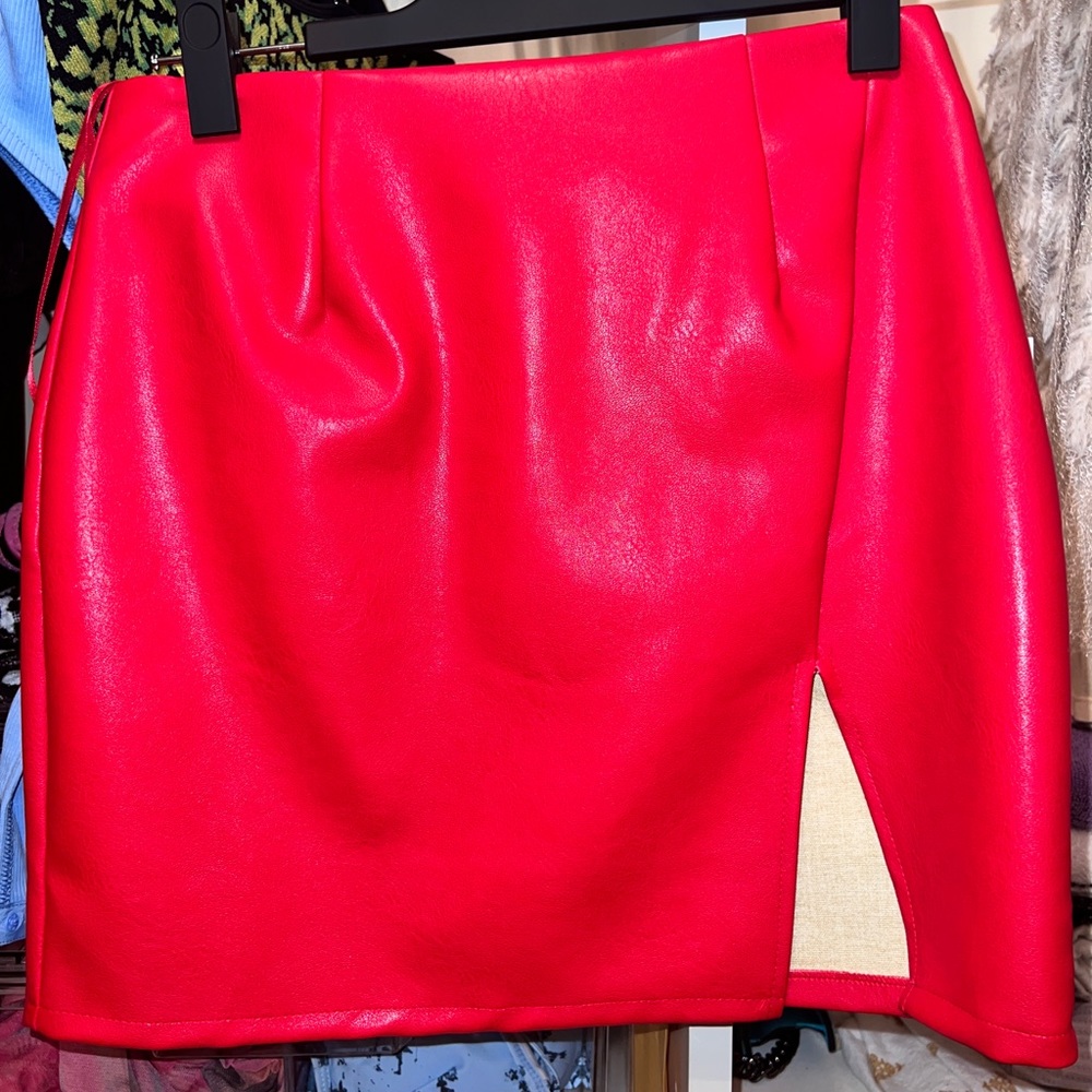 Brand new red never worn super dry leather skirt with mini slit